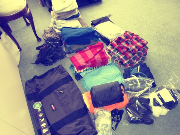 Piles of clothes ready to pack